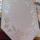 Beveled mirror with floral decor
