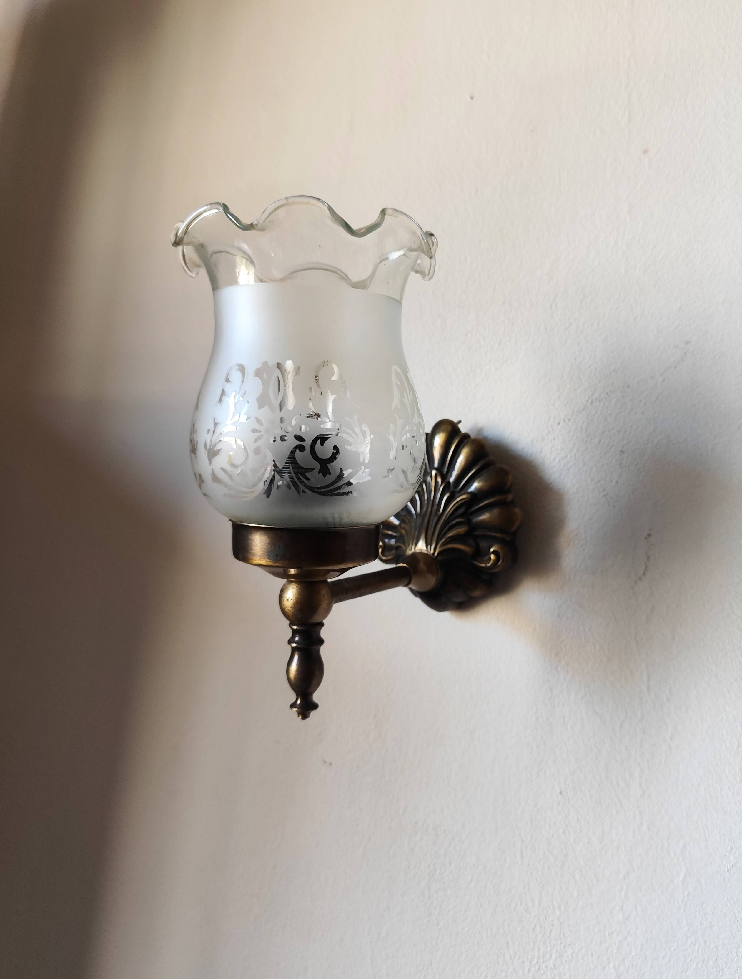 Pair of wall sconces in bronze with opaline glass tulips.