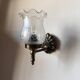Pair of wall sconces in bronze with opaline glass tulips.