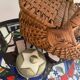 Brown woven vintage wicker basket with 2 lids.