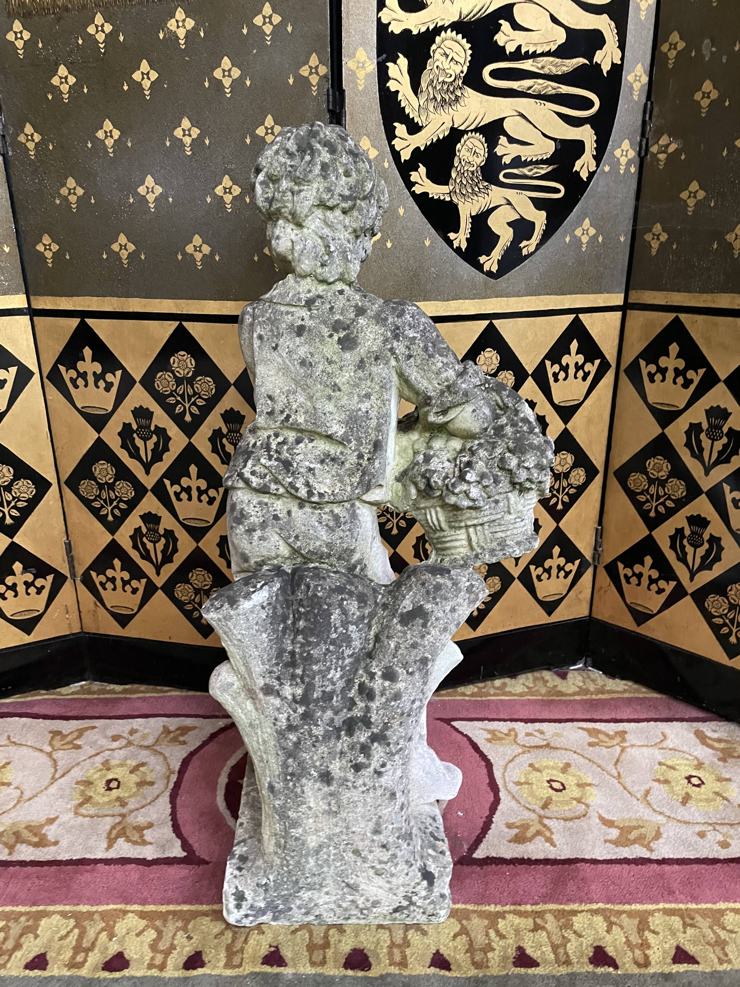 Stone garden statue to the child