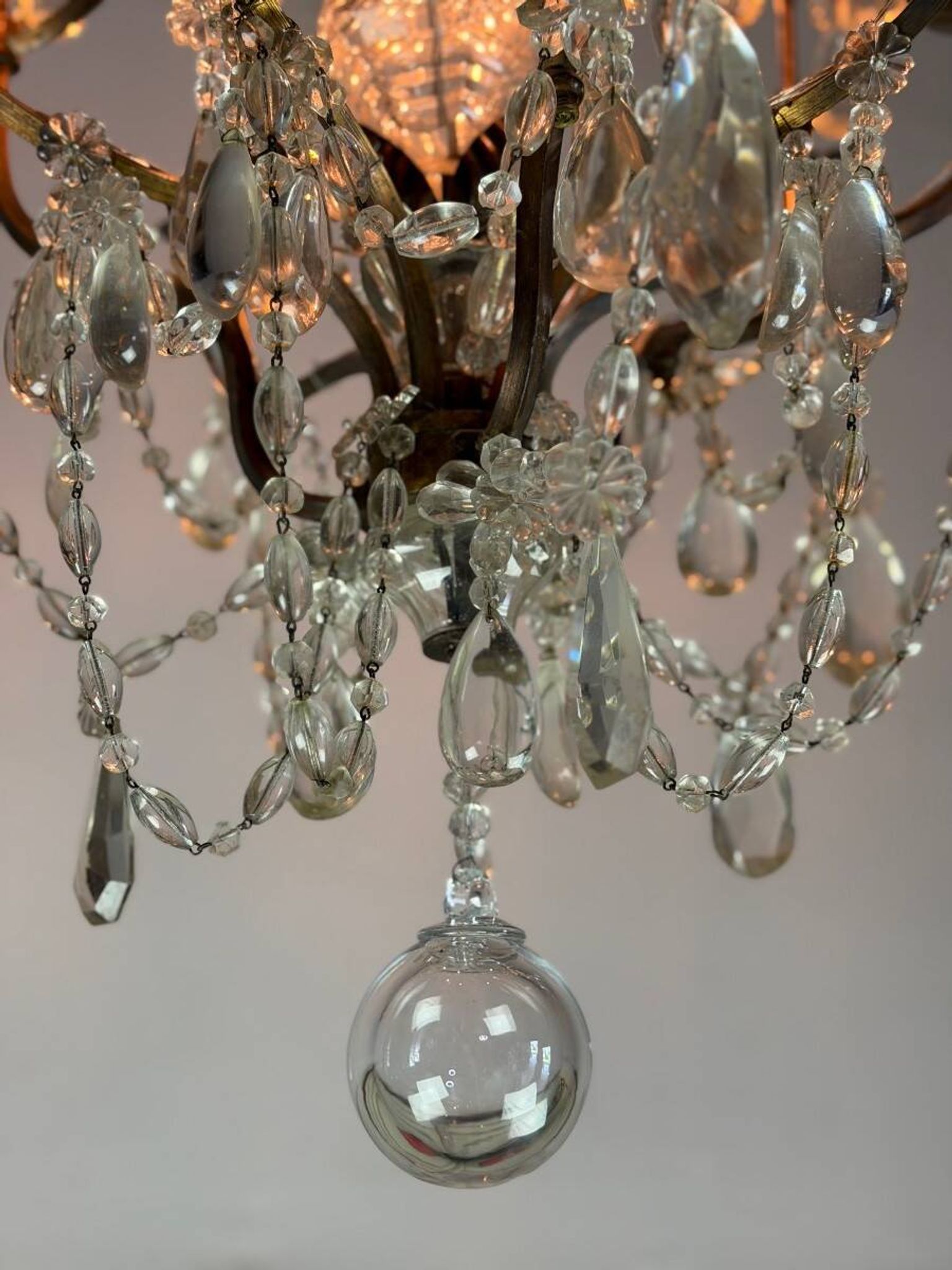 Bronze cage chandelier adorned with crystal drops, circa 1880