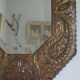 Antique bevelled artisanal mirror in repoussé copper - 54x45cm