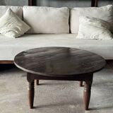 Coffee table, round antique Indonesian teak table with straight legs.