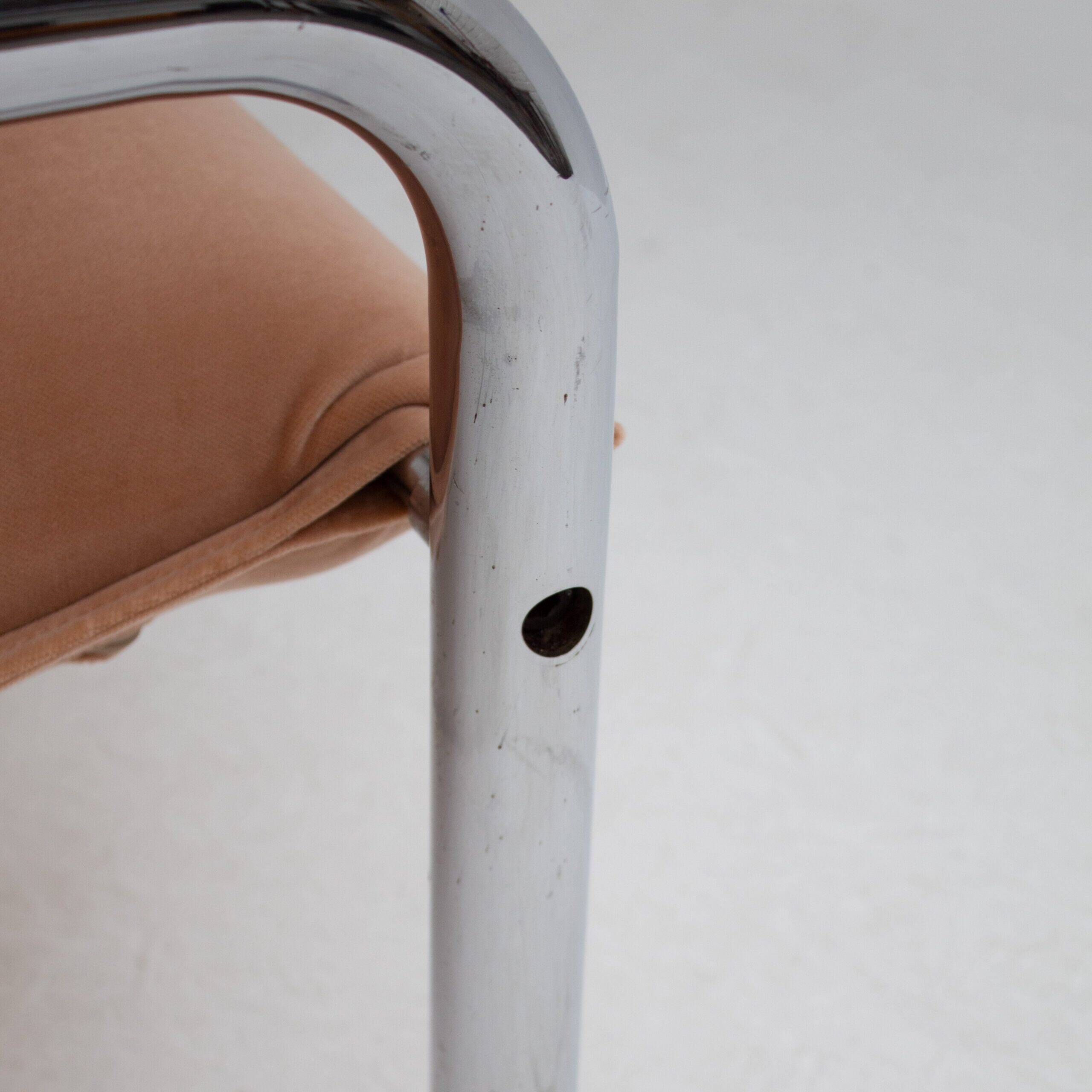 Pair of tubular armchairs in salmon velvet