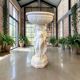 Vintage white concrete garden statue adorned with planter.