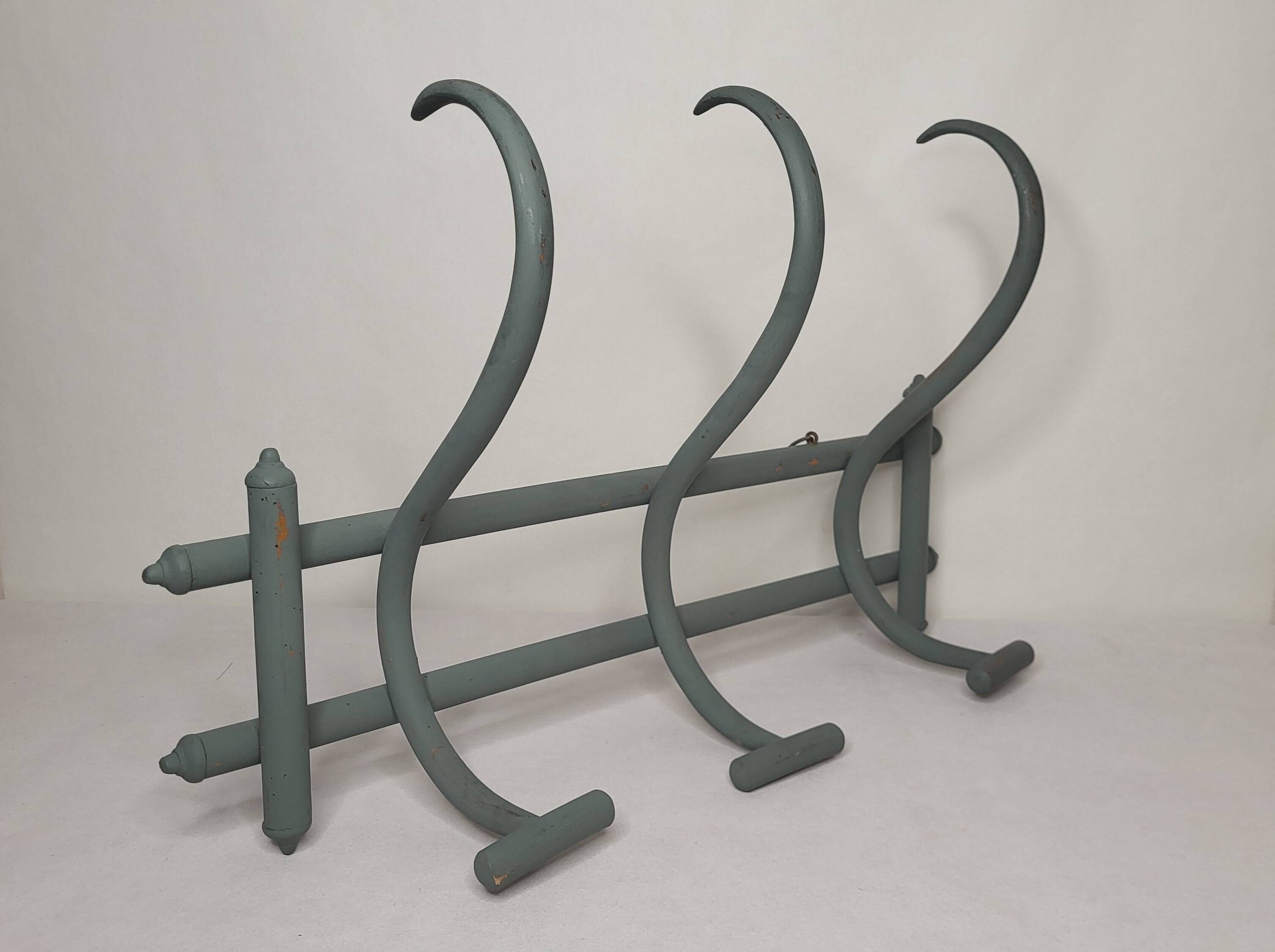 Curved wooden coat rack
