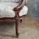 Small sofa or bench in Louis XV style, rococo.