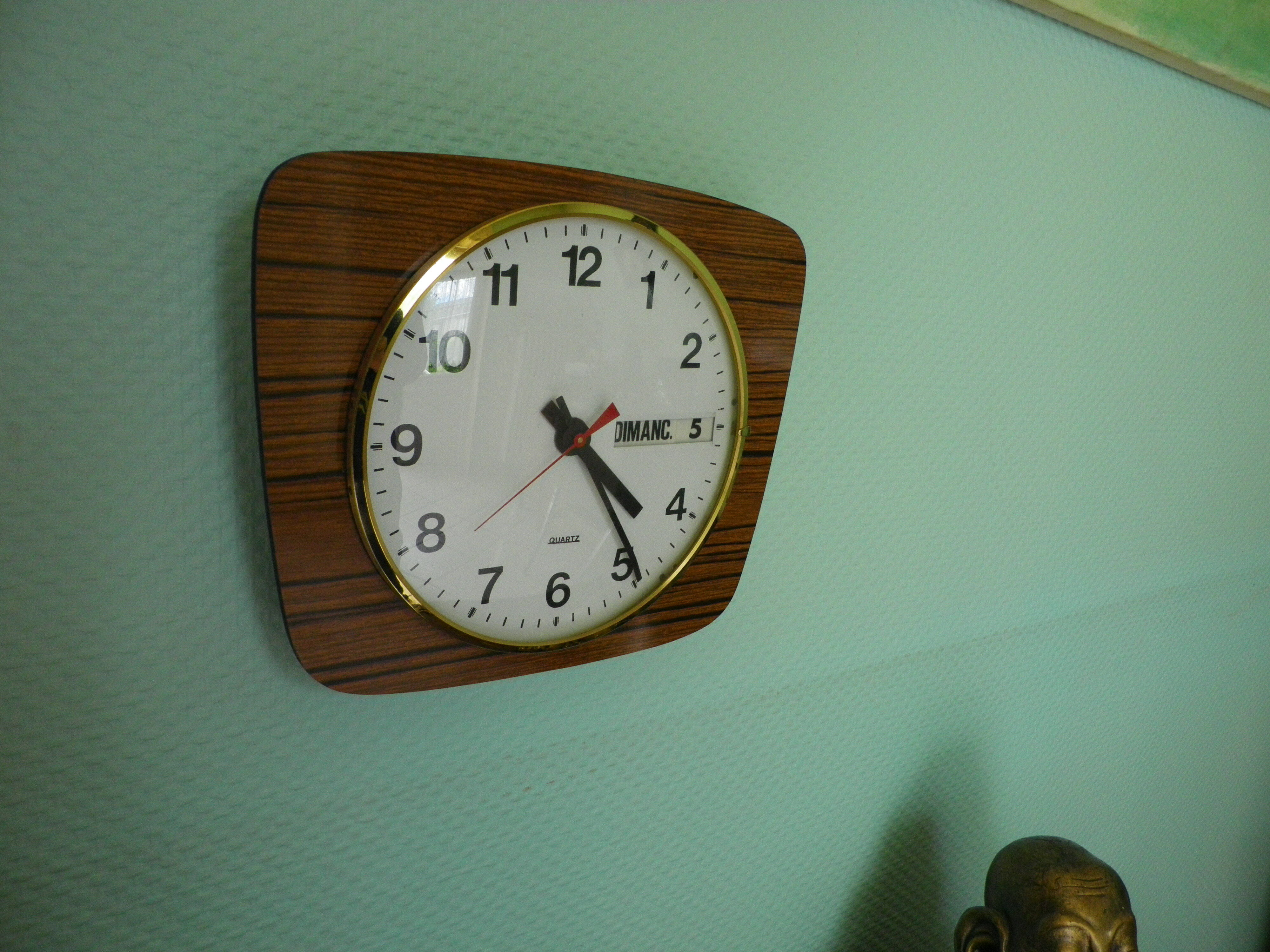 Formica wall clock with day and date - 1970s