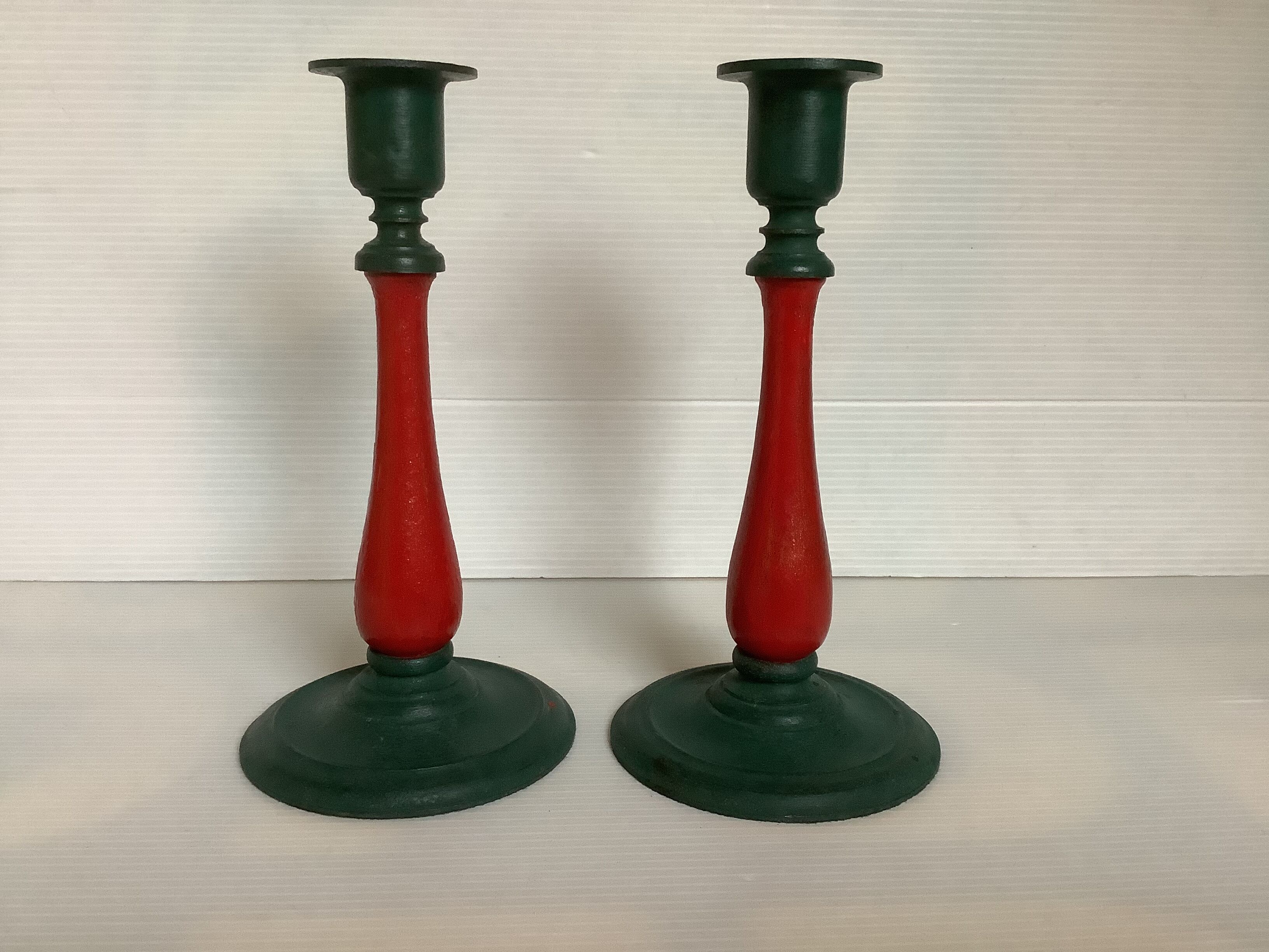 Pair of cast iron and wood candle holders