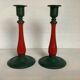 Pair of candlesticks in cast iron and wood
