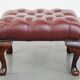 In very good condition elegant red/brown chesterfield ottoman made of cow leather