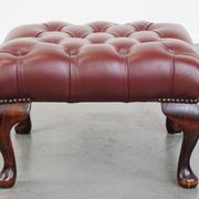 In very good condition elegant red/brown chesterfield ottoman made of cow leather