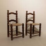 Pair of rustic chairs in turned wood with straw seats