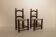 Pair of rustic chairs in turned wood with straw seats