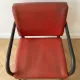 3 red leather and metal armchairs