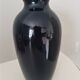 Cobalt blue porcelain vase from Limoges, France with floral pattern.