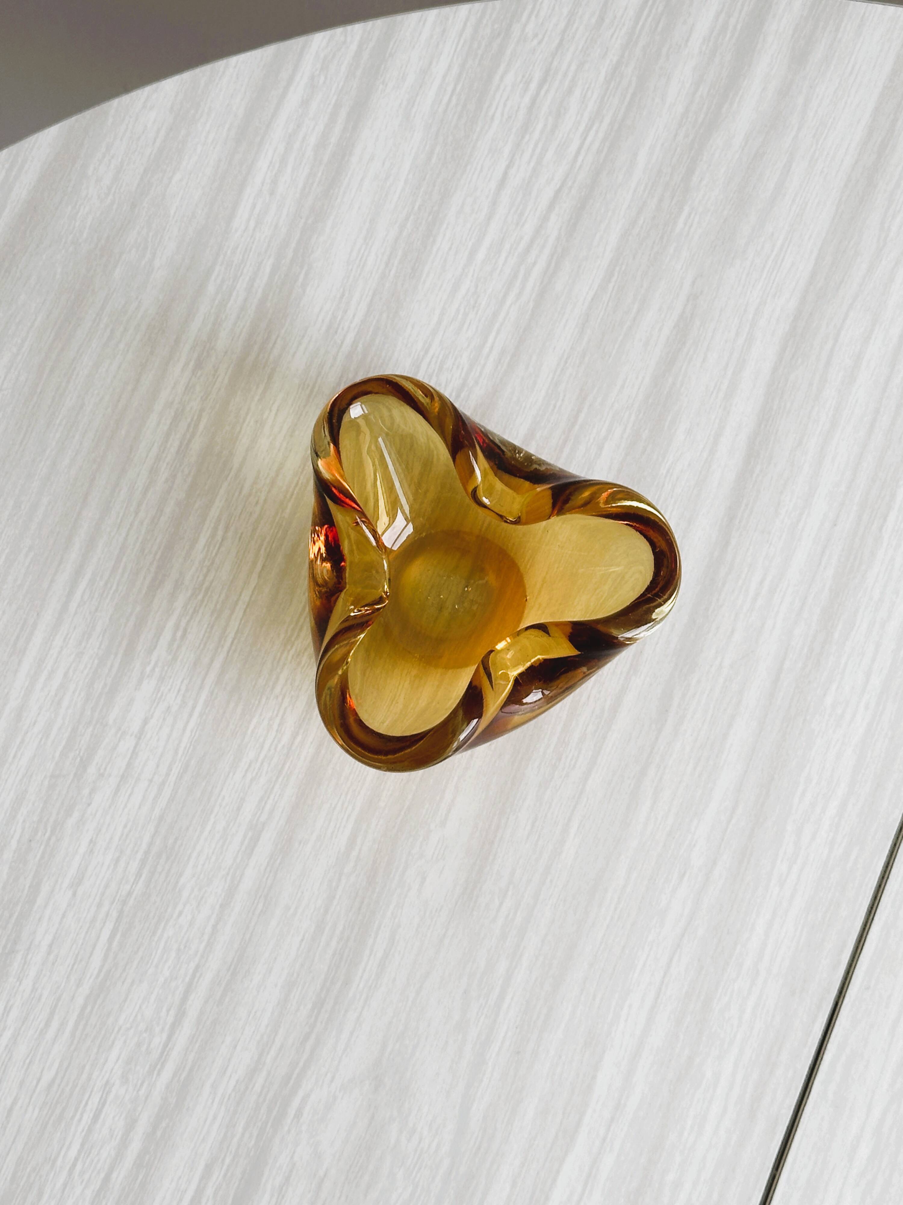 Thick amber yellow glass ashtray