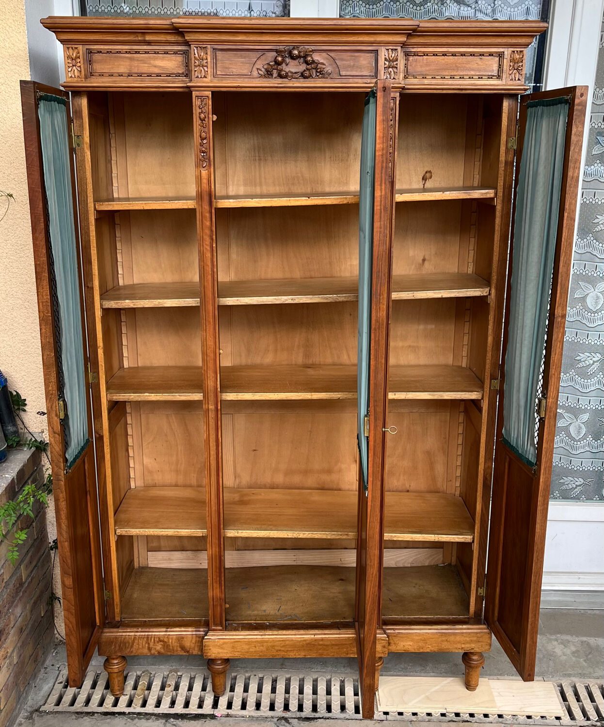 Antique carved wooden bookcase