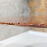 Round table in red marble by Eero Saarinen for Knoll