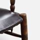 Antique rustic armchair in walnut and leather, 18th century.