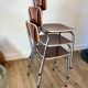 Trio of chairs in light brown formica and cream contour 70s