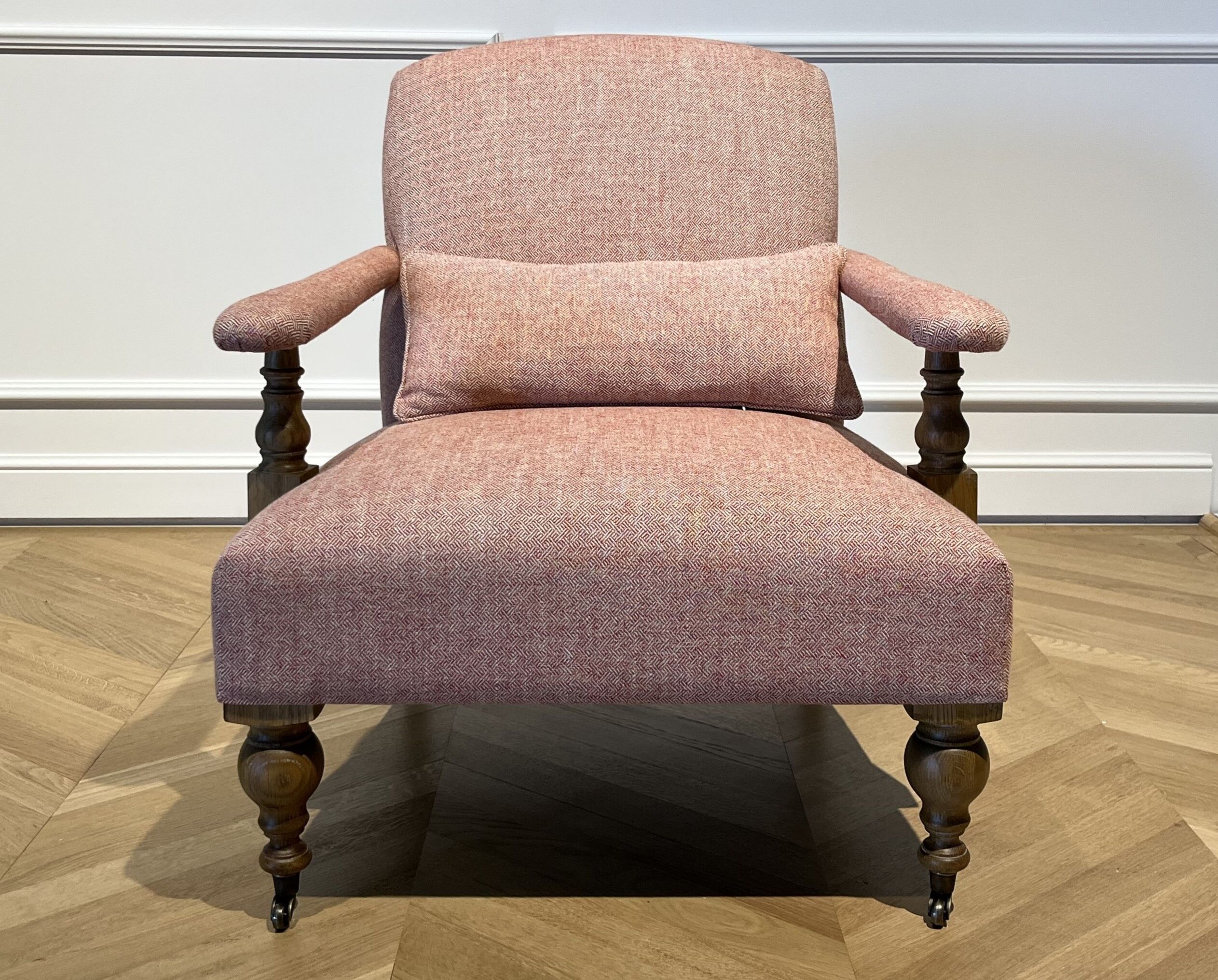 Wooden and red chevron fabric armchair with casters