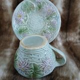 Antique cup and saucer in majolica.