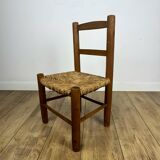 Pair of old wooden and straw children's chairs.