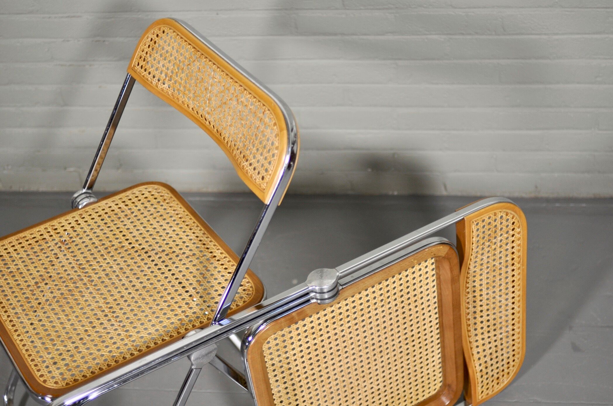 Four 'Plia' chairs by Giancarlo Piretti for Castelli