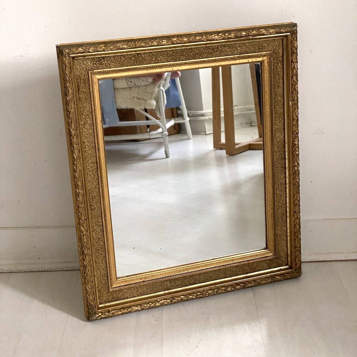 Small wooden mirror with gilded stucco in the Louis XVI style.