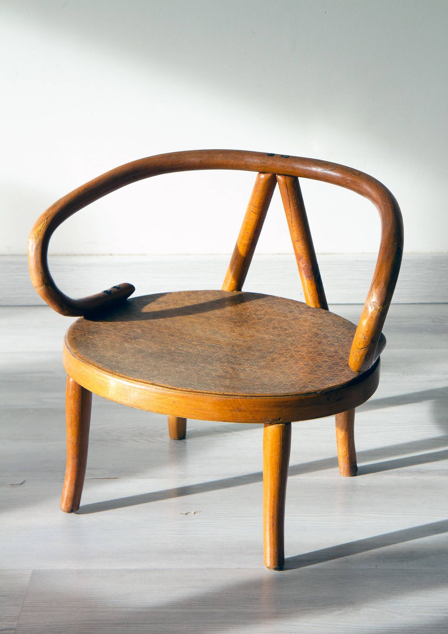 Le Corbusier style curved wood children's armchair, early 20th century