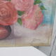 Tableau of a bouquet of flowers on a double-sided wooden panel.