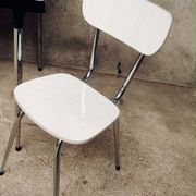 Table and 2 chairs set made of Formica.