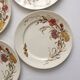 4 flat plates in polychrome iron earth model "Carnations" Gien gold medals