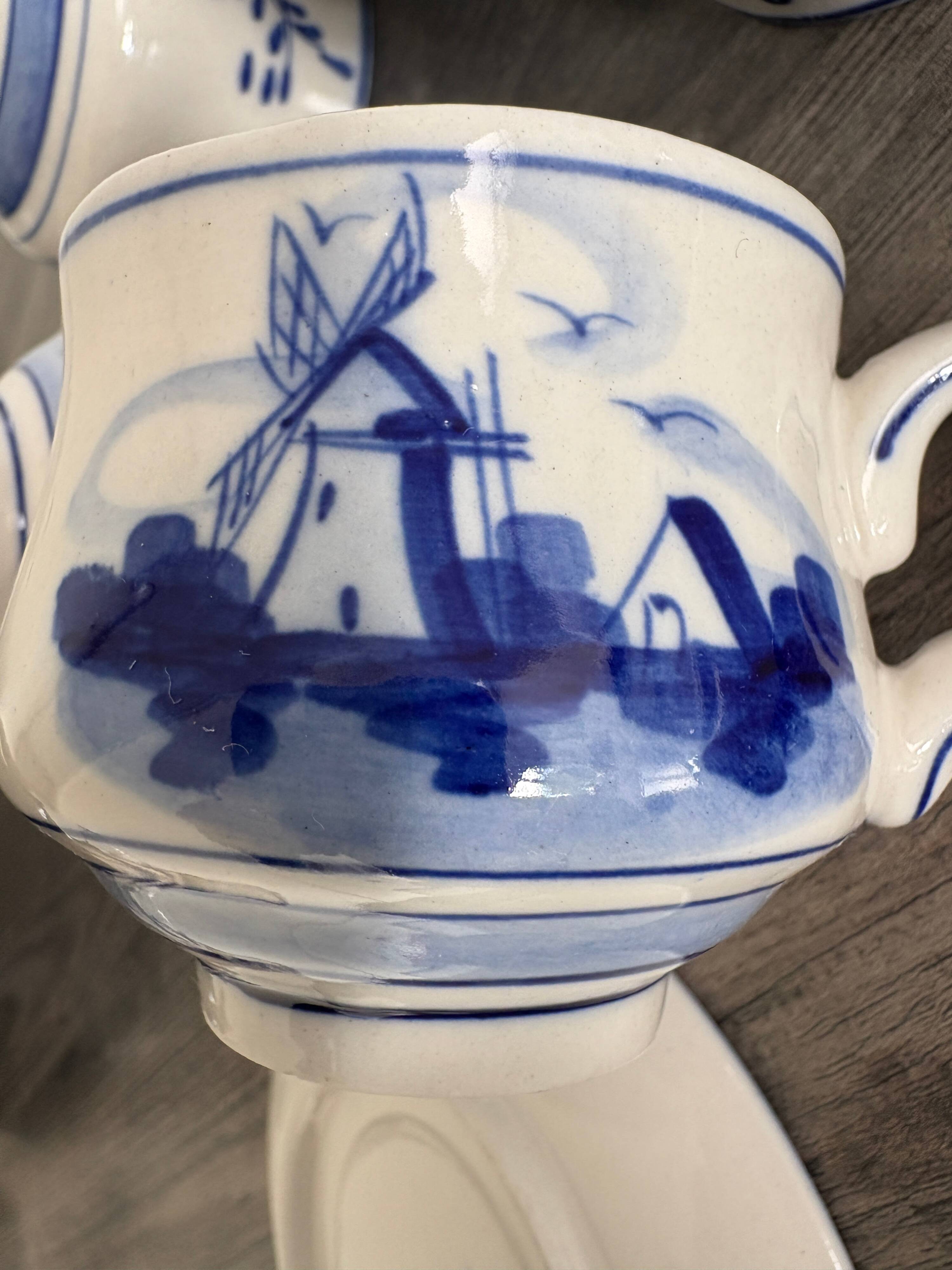 Vintage Dutch Delft Blue earthenware service for 5 cups and saucers.