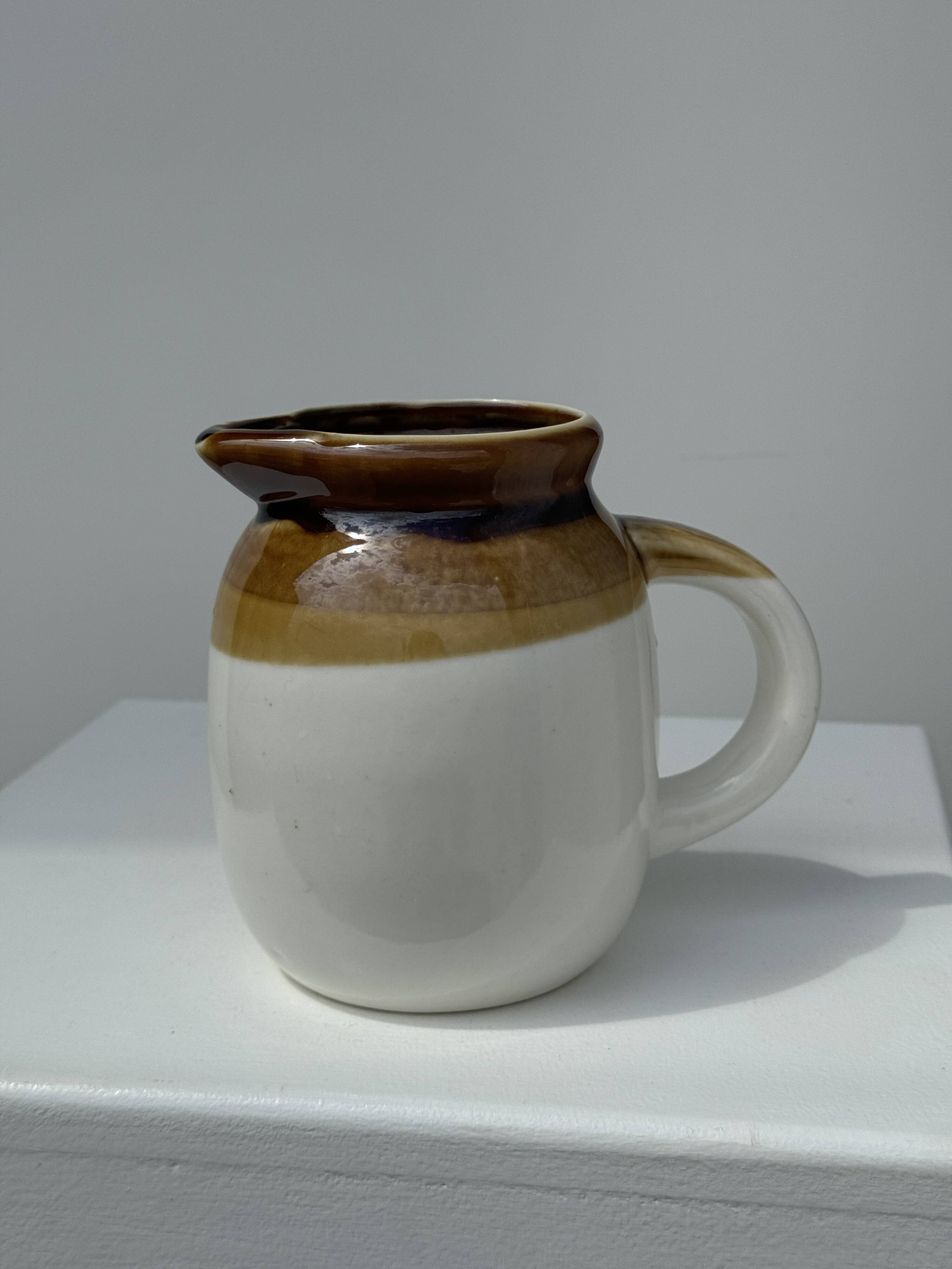 Small two-tone white and brown pitcher Made in China