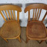 4 mismatched signed bistro chairs