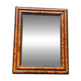 Tortoiseshell mirror and black curly wood in the style of Antwerp frames