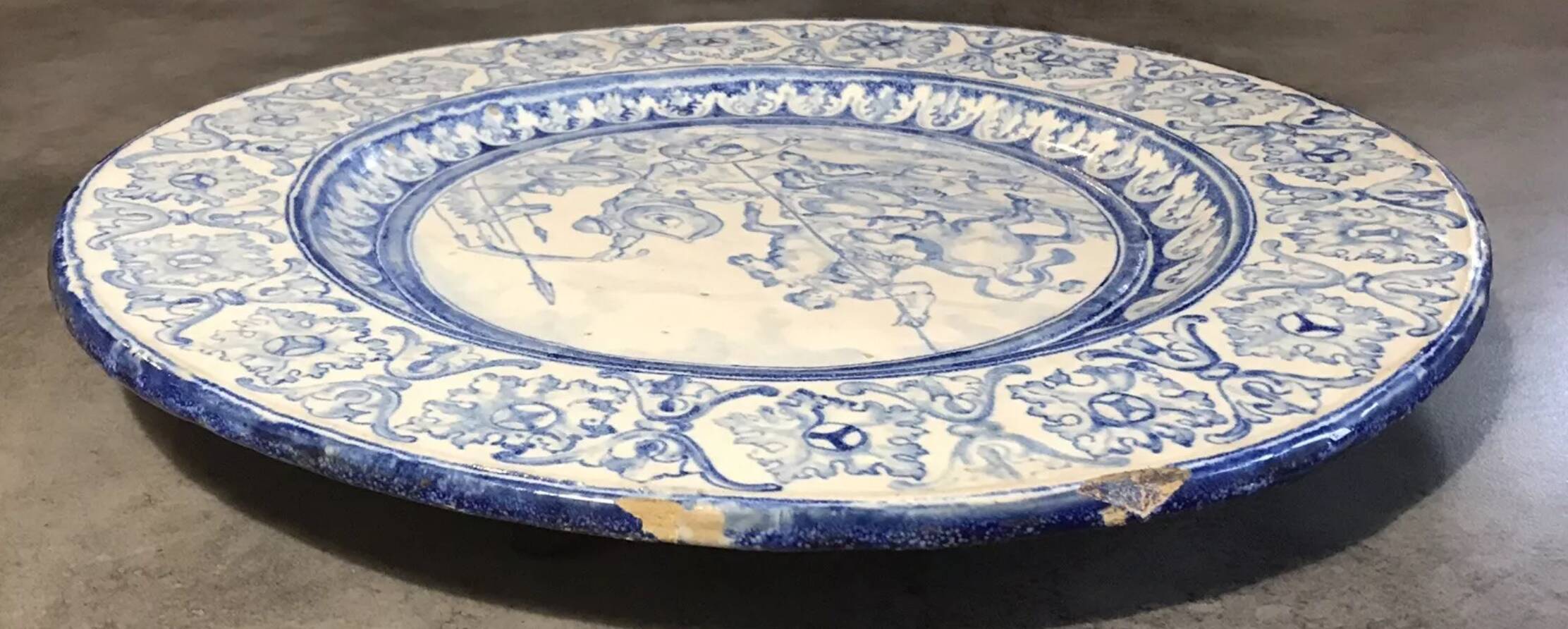 Antique glazed ceramic wall plate with battle scene decoration 41.5 cm