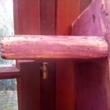 Low bench rests feet in patinated wood