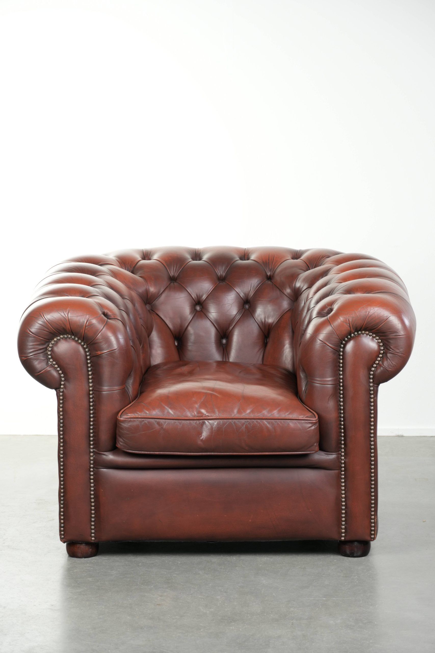 Cowhide Chesterfield armchair in a classic English style
