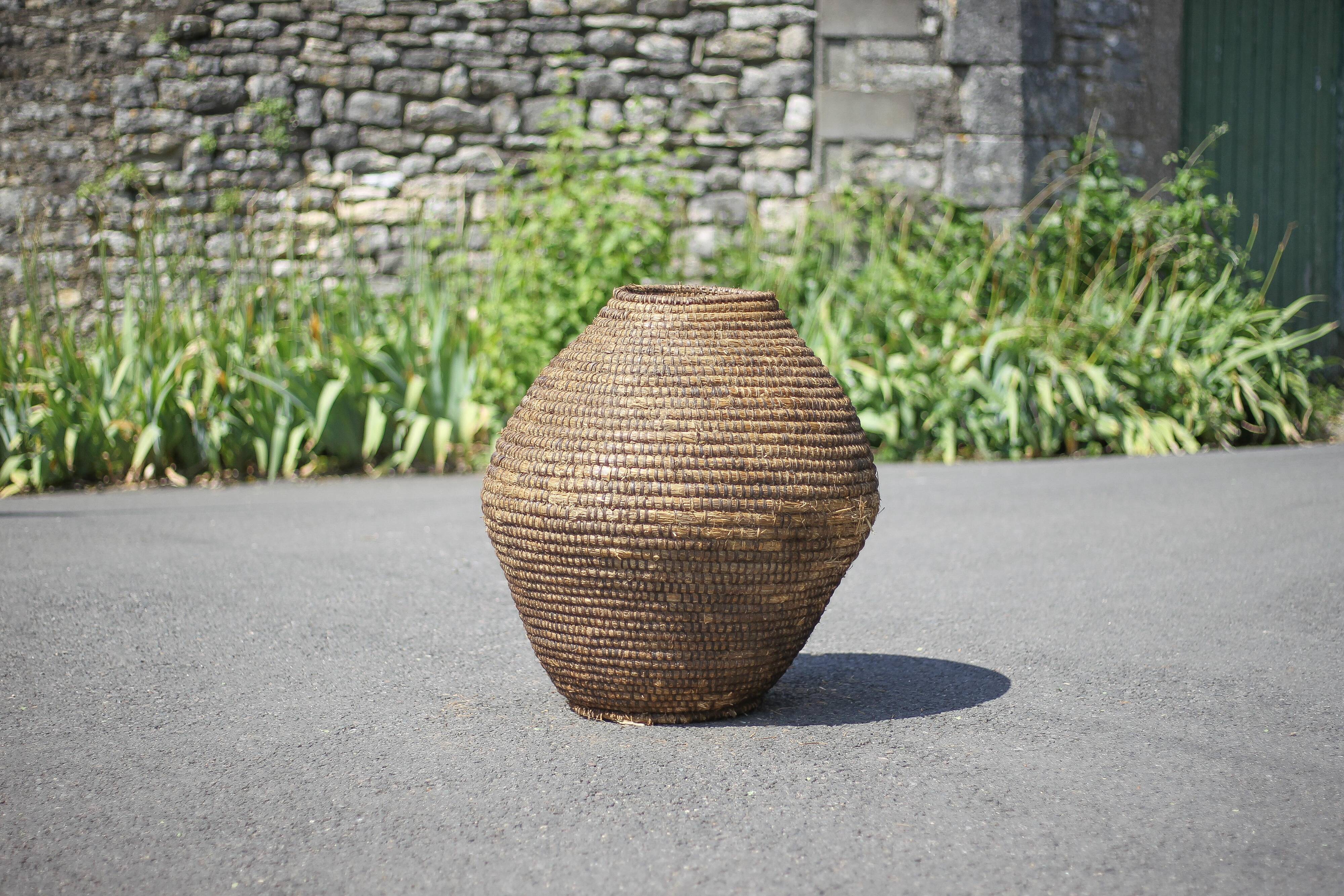 Large old basket, burgundy straw and bramble, woven basket