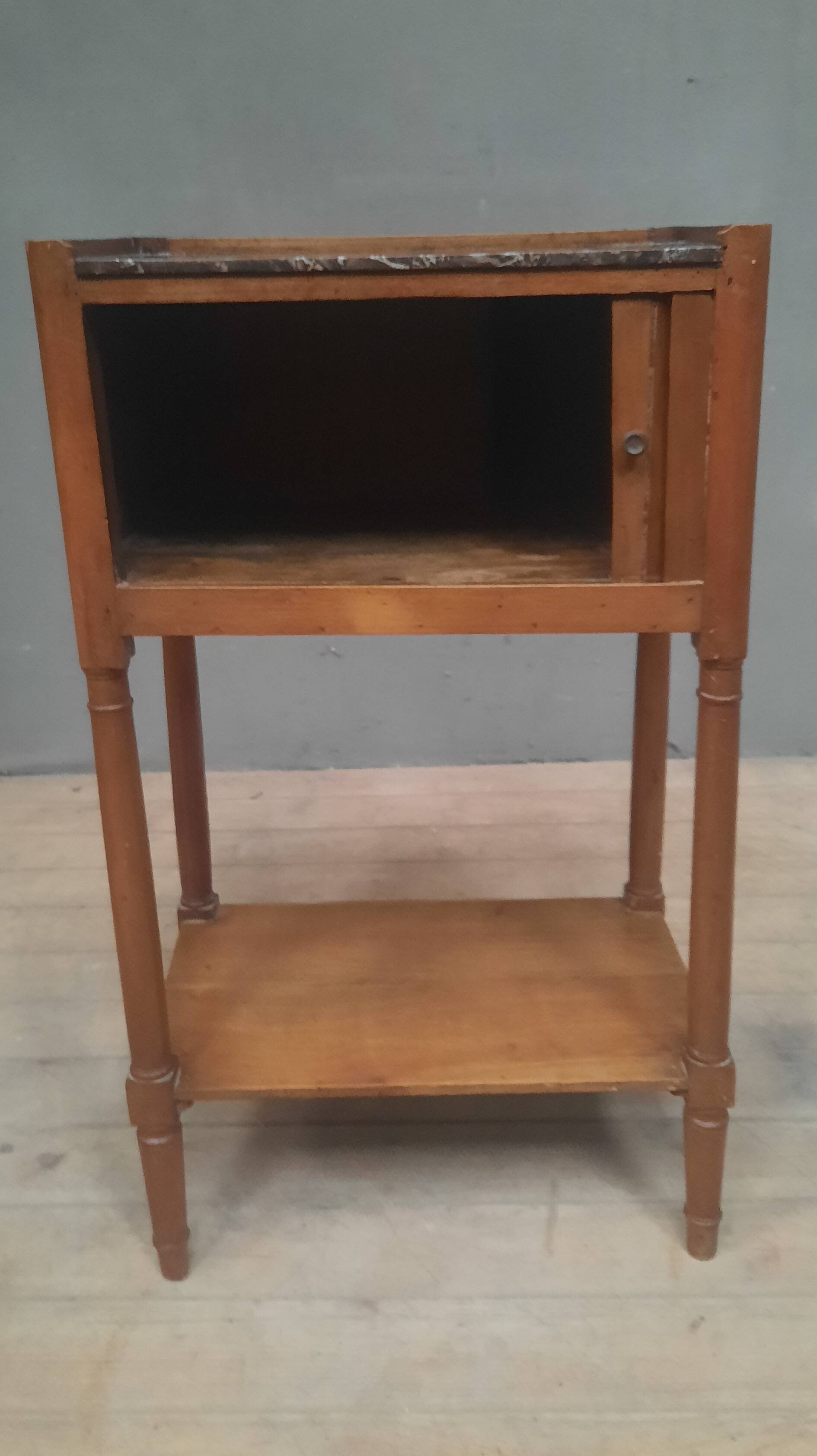 Curtained bedside table from the nineteenth century.