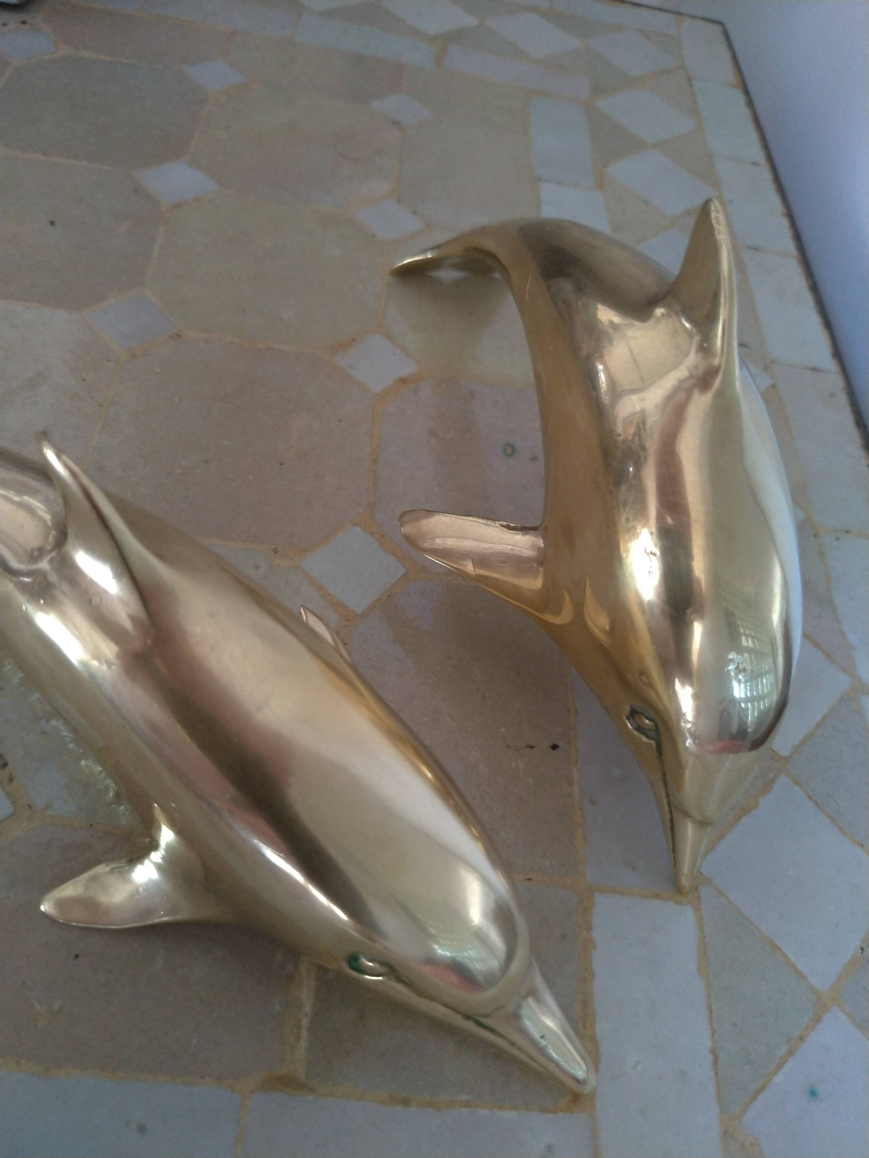 Brass dolphins