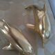 Brass dolphins