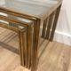 Set of 3 nesting tables in brass and glass. French work by Guy Lef.