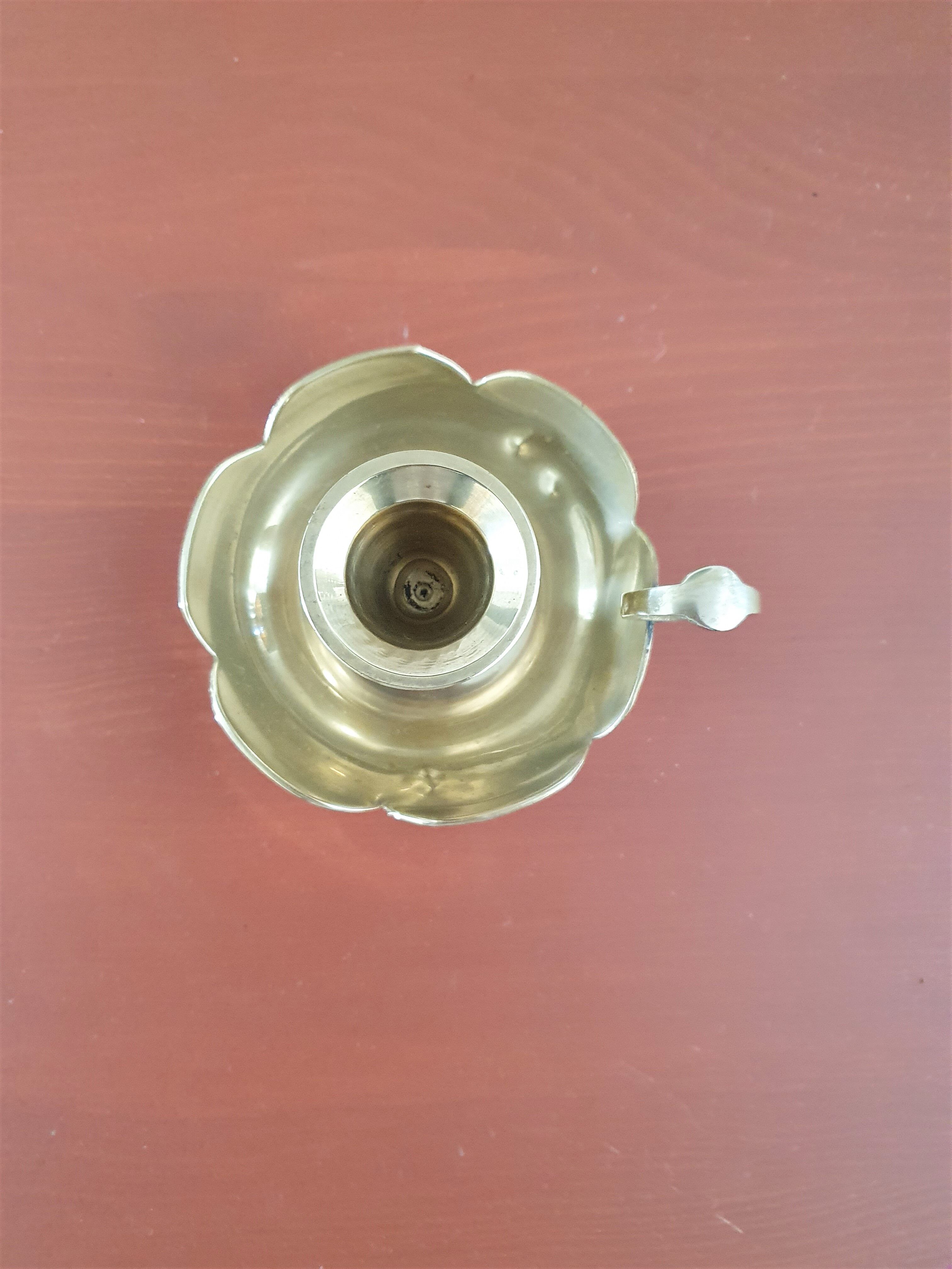 Golden brass candle holder