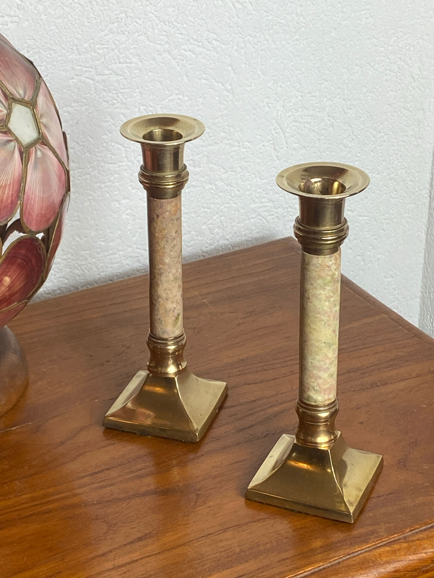 Pair of brass and stone candlesticks