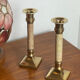 Pair of brass and stone candlesticks